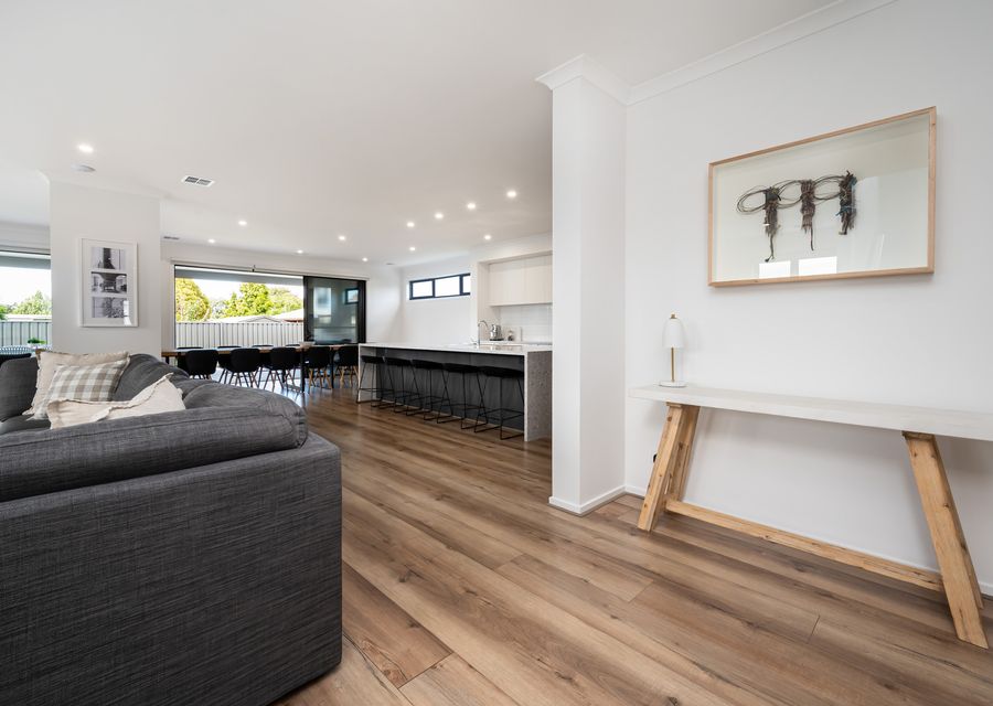 Lounge area adjacent to dining and kitchen area 