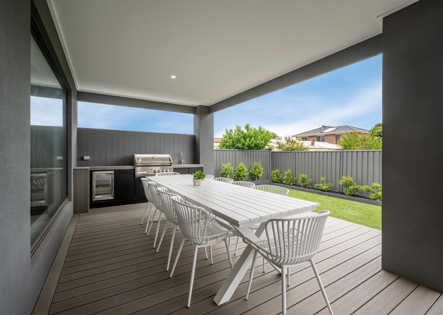 BBQ area with outdoor seating and dining table 