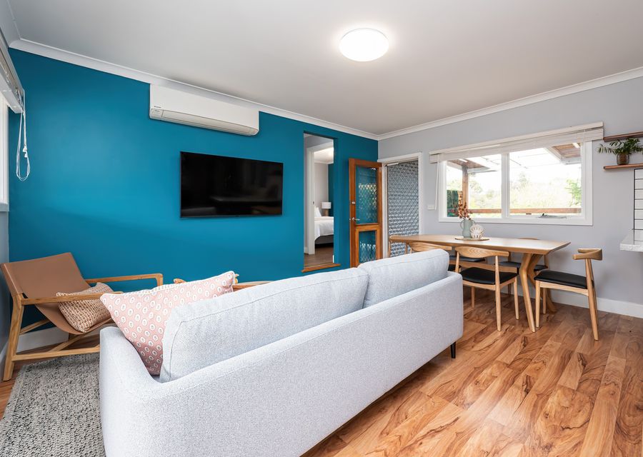 Lounge area with split system AC and Smart TV
