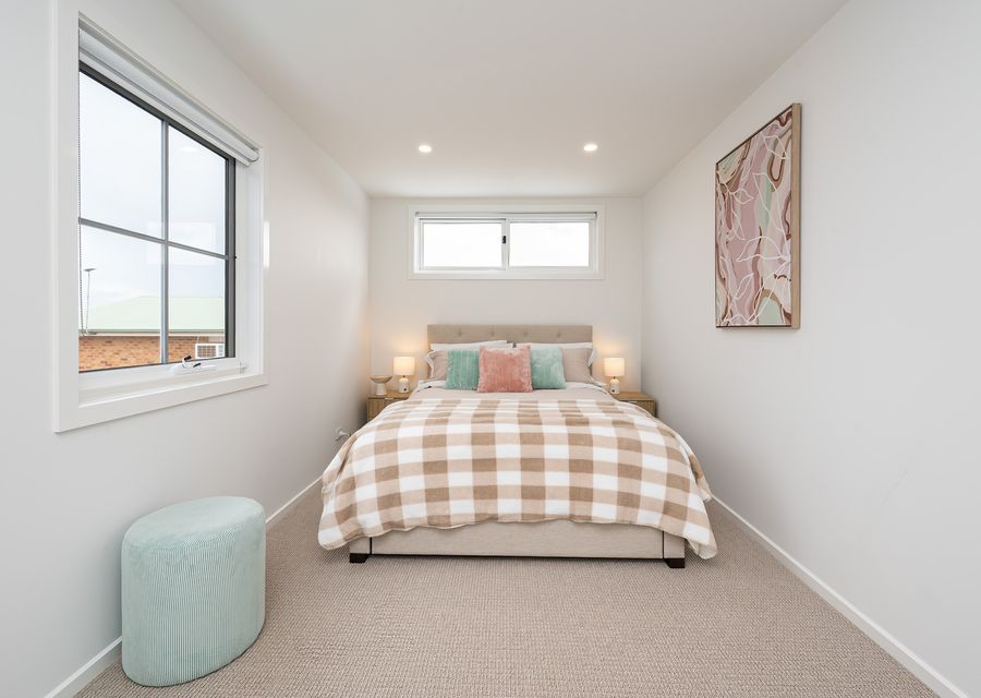 Upstairs, Bedroom 2 is furnished with a comfortable Queen bed.