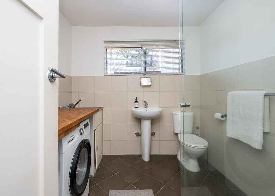 Bathroom and laundry in one with walk in shower