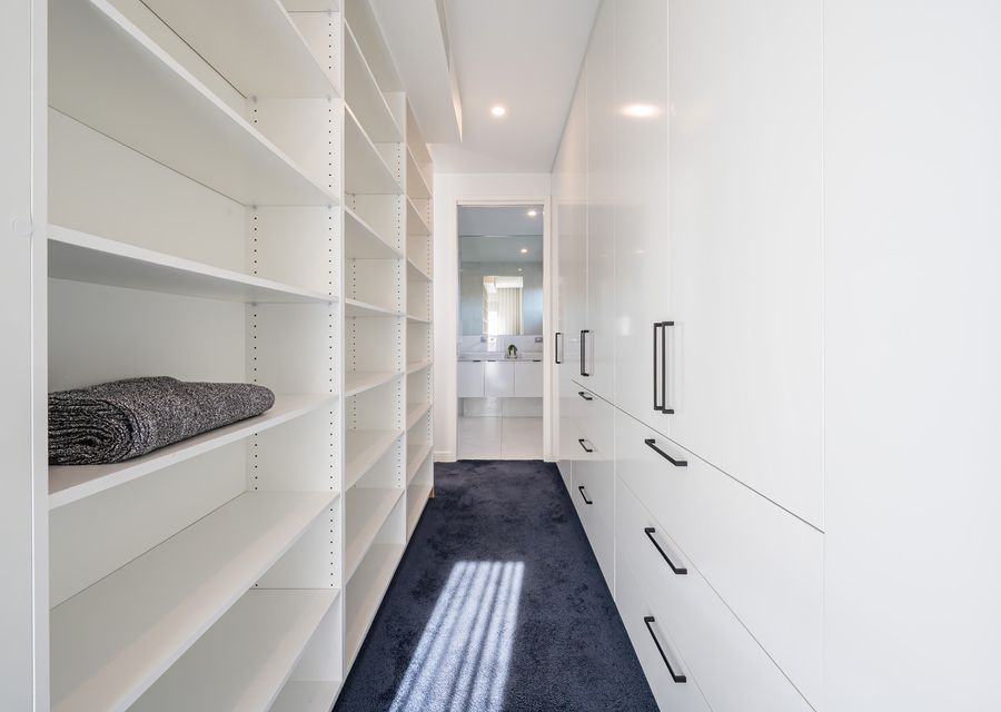 Plenty of storage in master bedroom walk in robe