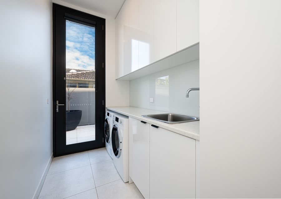 Separate laundry with front loader washing machine and dryer