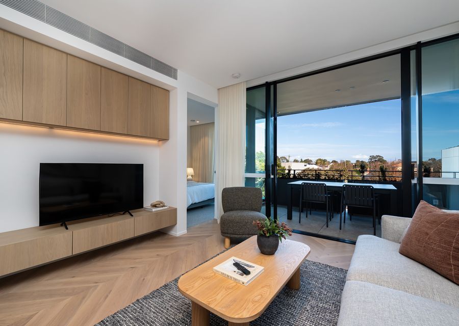 Living with smart Tv and access to private balcony for outdoor dining 