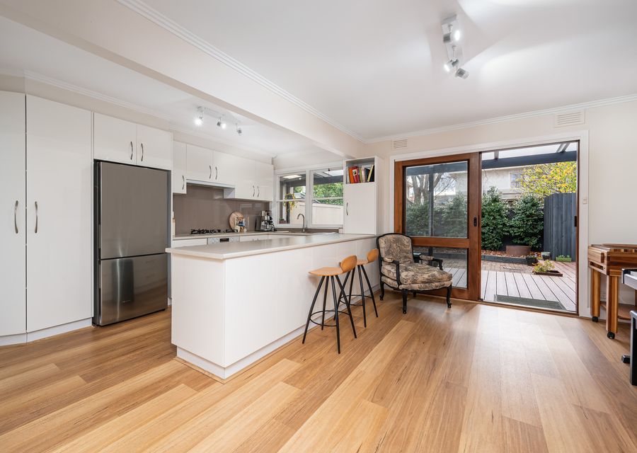 Breakfast bar with seating for 3 and access through to the outdoor decking
