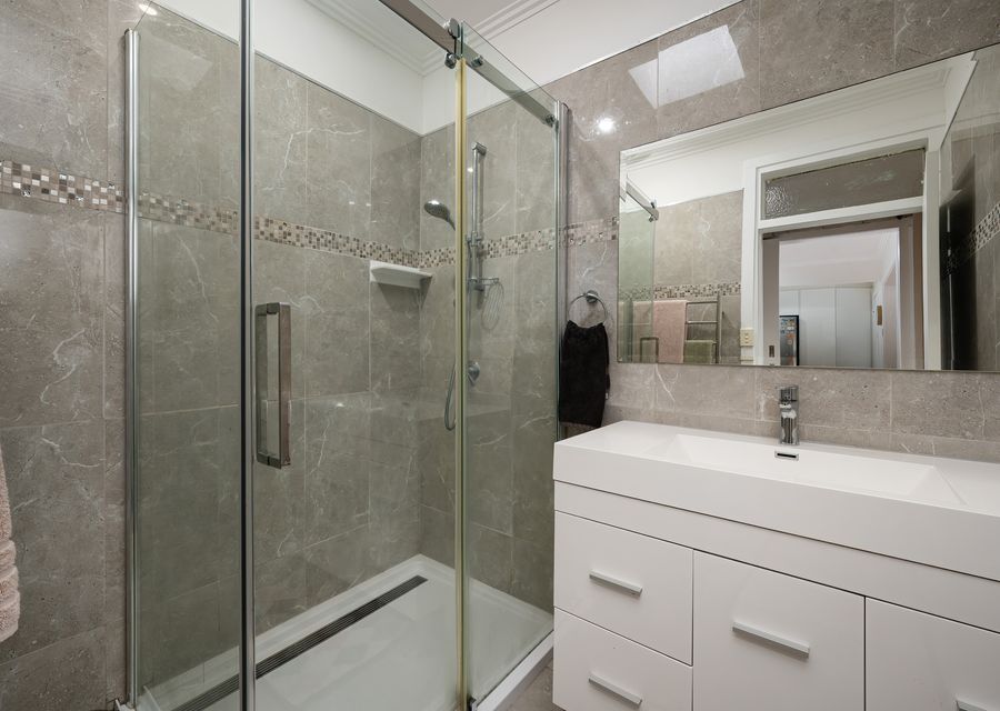 Bathroom with shower and separate toilet