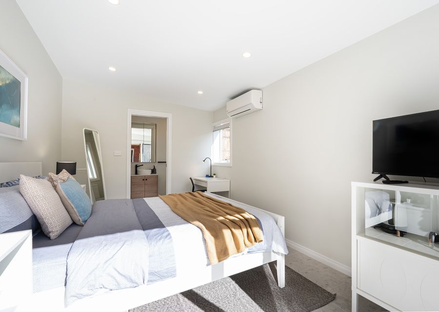 Studio with split system for heating and cooling, smart tv, bed, desk space and bathroom