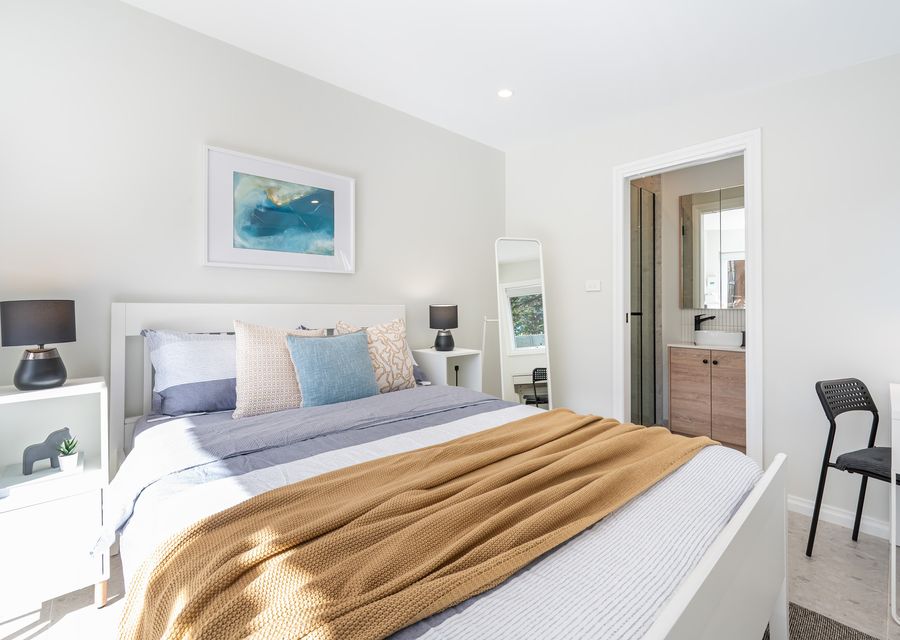 Bedroom 3 with King bed located in separate studio at rear of property