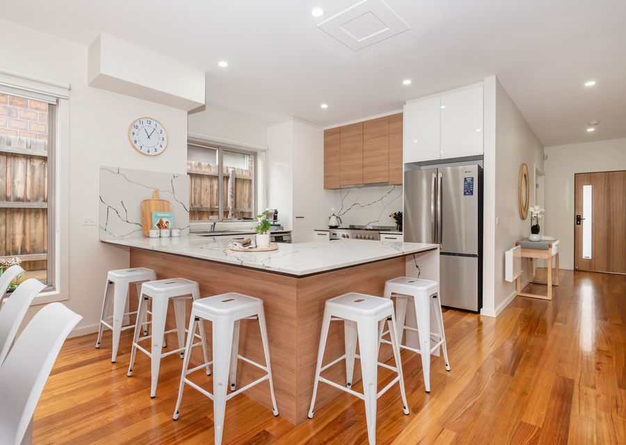 Sleek kitchen area with breakfast bench seating