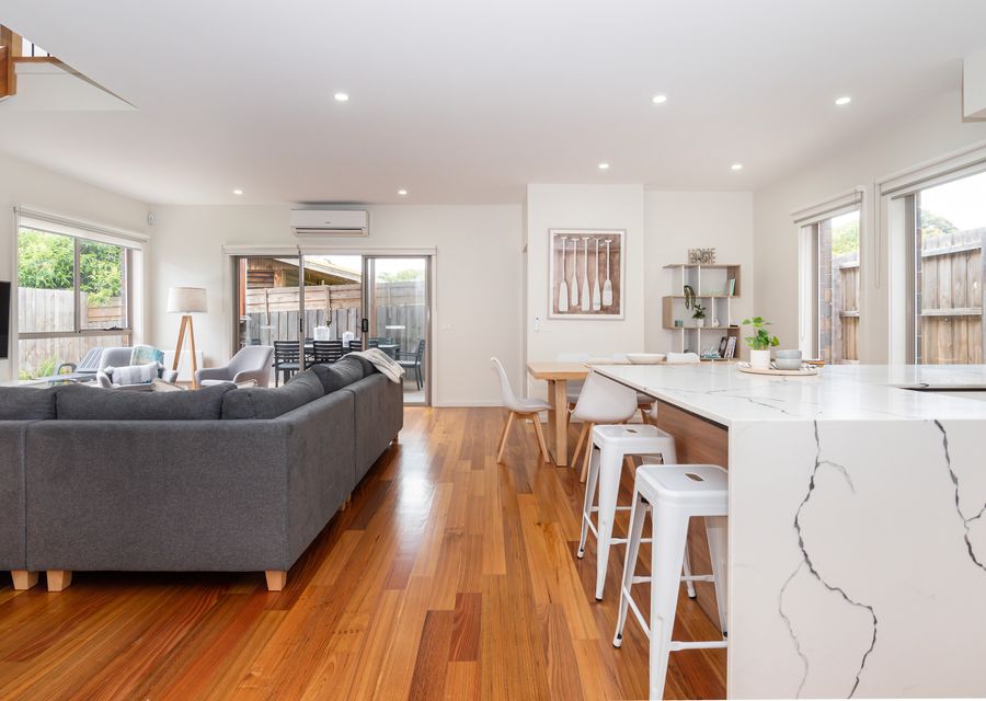 Downstairs features an open plan kitchen, living and dining area 