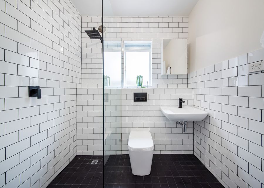 Ensuite with walk in shower, single vanity and toilet