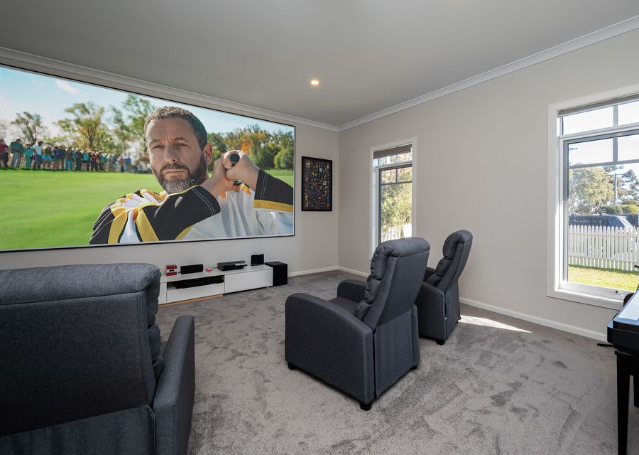 hige projector screen in movie room