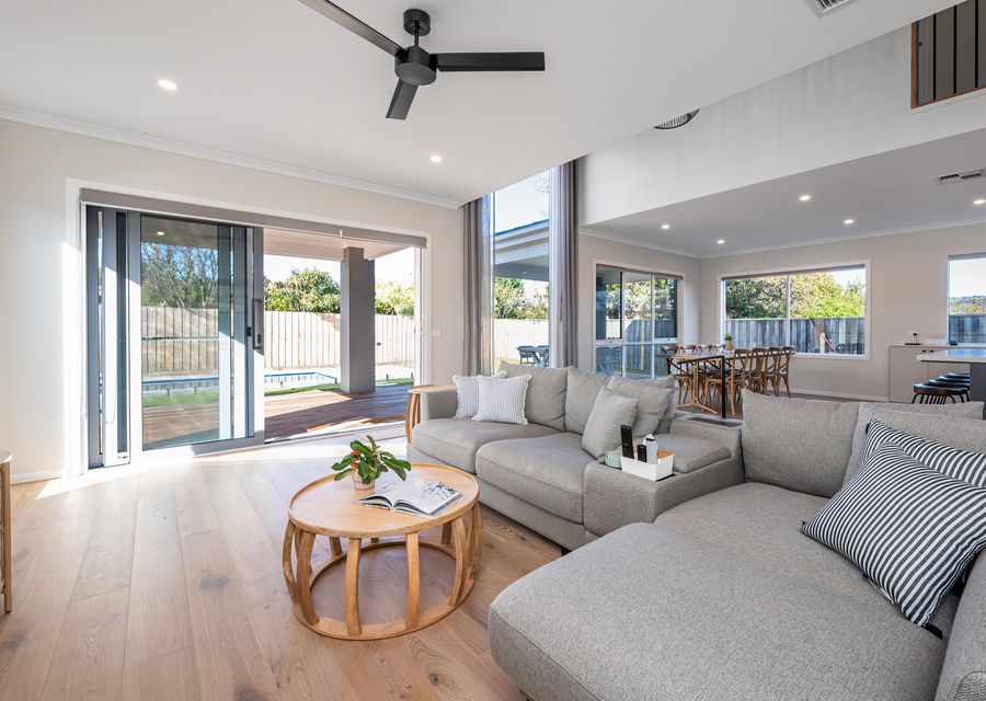 Light and bright living spaces looking over the pool area 