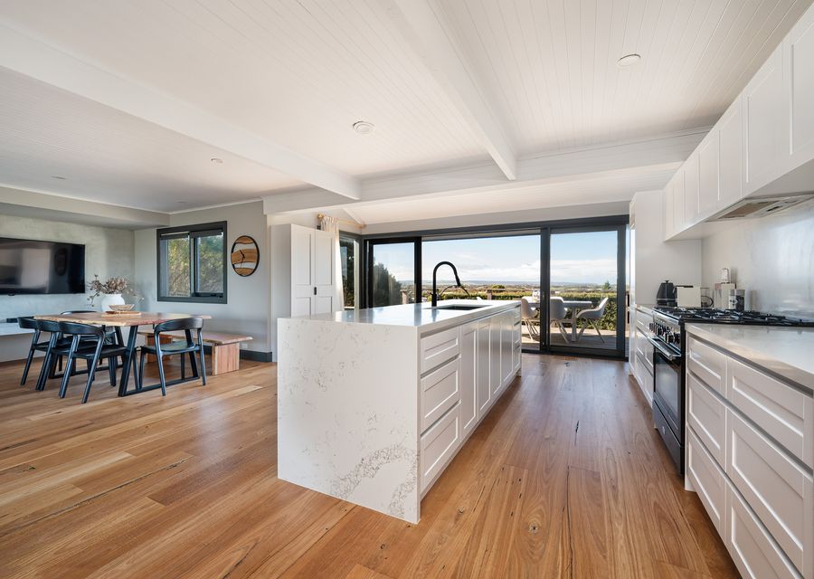 Kitchen and dining, leading out to balcony 