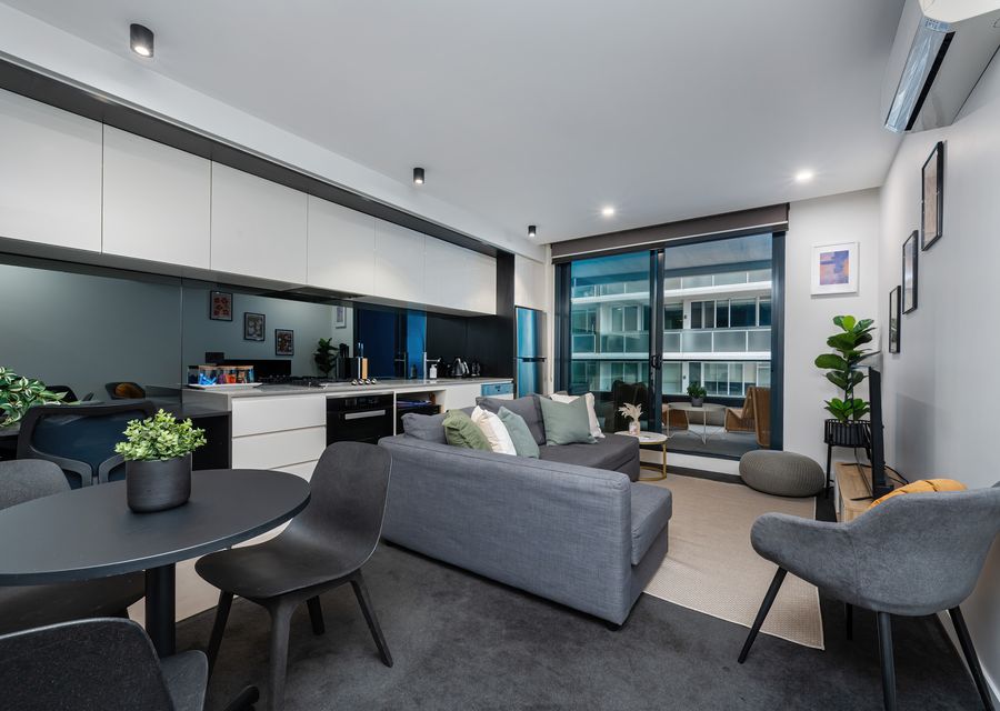 Open plan living with large glass doors to balcony