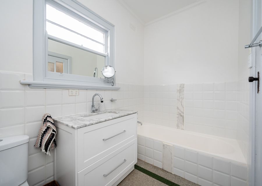 Upstairs bathroom with bath and shower 