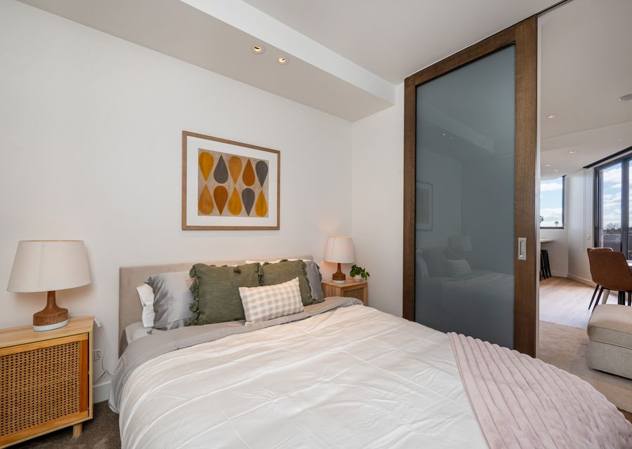 Main bedroom with Queen bed located off the living area seperated by a block out sliding door