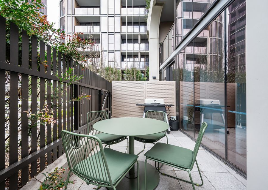 Secure outdoor seating area and courtyard with bbq