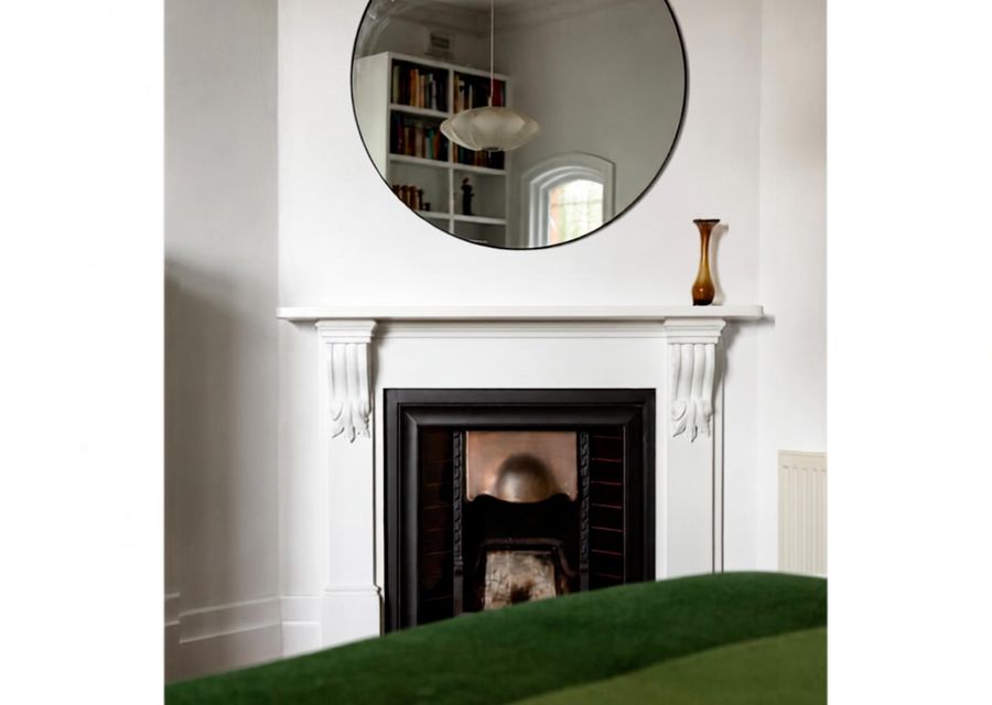 Original fireplace adding warmth and character to the home