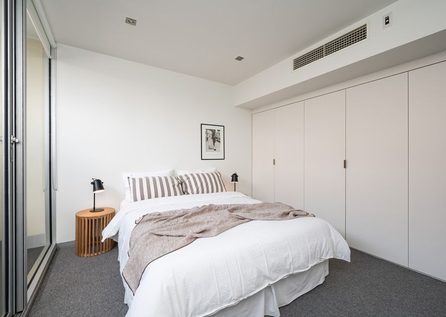 Bedroom 3 with built in robes and access to outdoor space