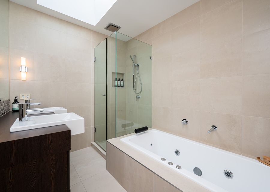 Family bathroom with step in shower, bath and double vanity
