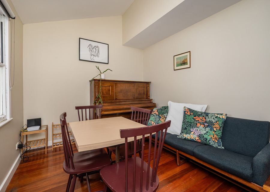 Featuring a dining area, cozy lounge seating, and a beautiful vintage piano should you wish to add some music playing.