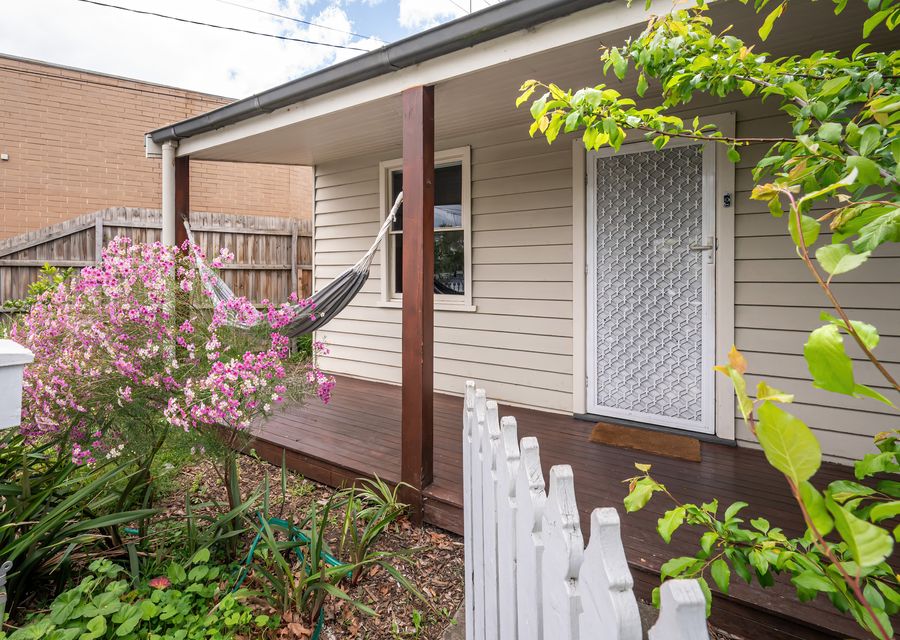 Front facade of the property with lazy hammock