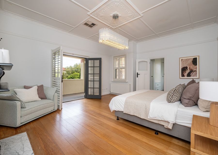 Master bedroom with ensuite, king bed and king single fold out couch with balcony access 