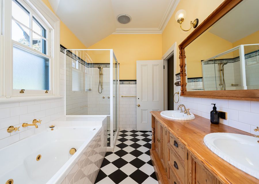 Full bathroom with shower, tub, and toilet 