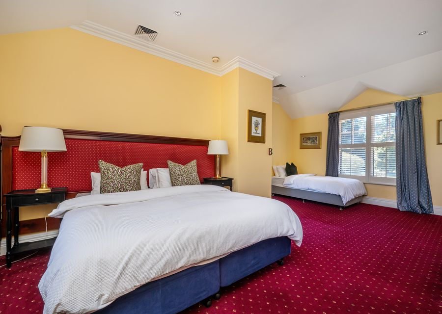 Bedroom four with king bed and a single bed 