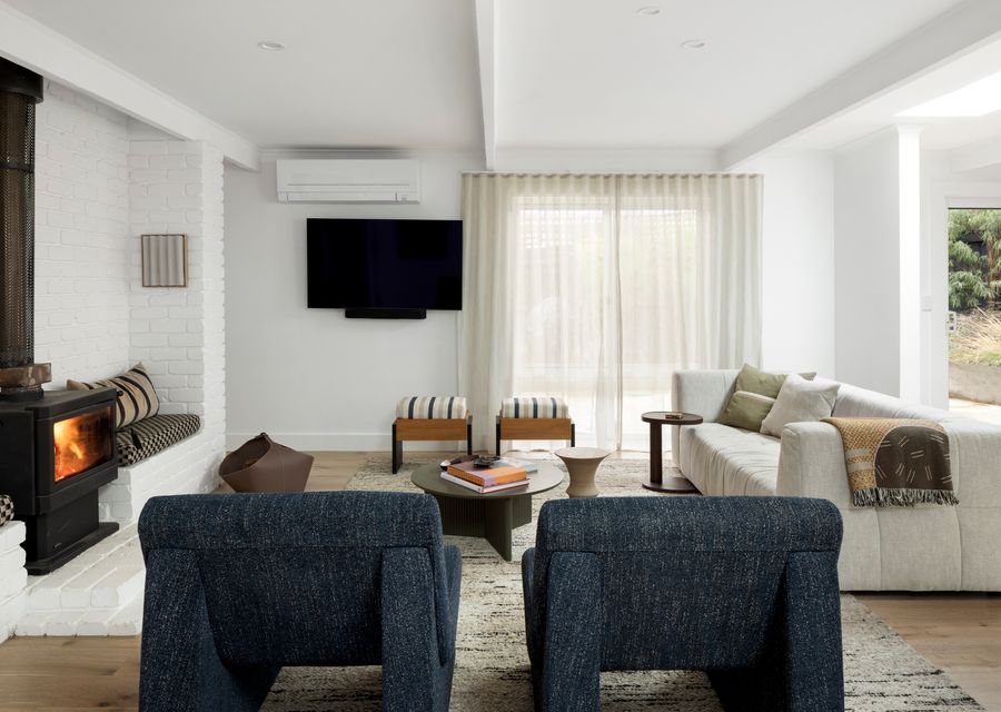 Lounge area with a fireplace and a smart TV