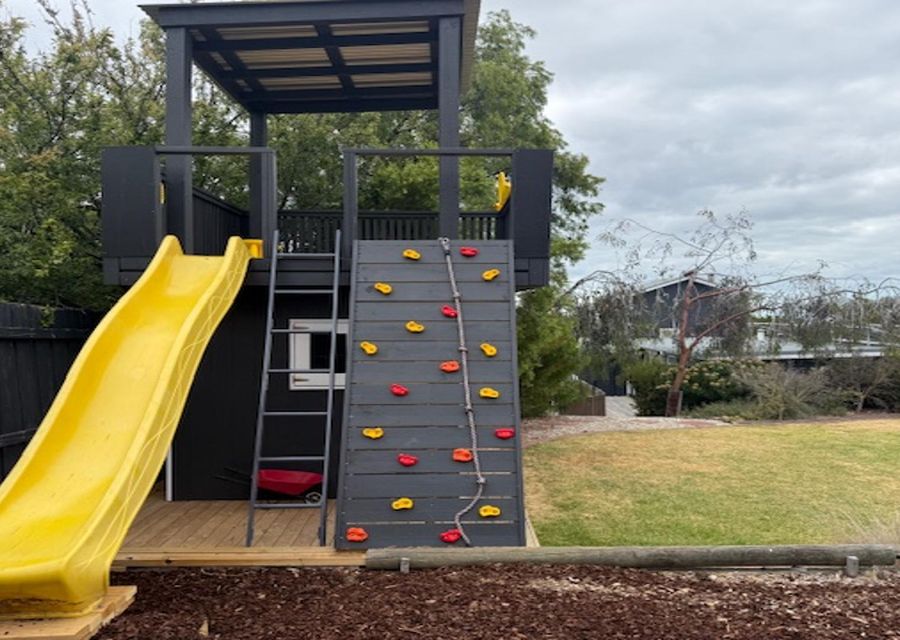 Amazing brand new Cubby for children with slide, climbing  space and monkey bars!
