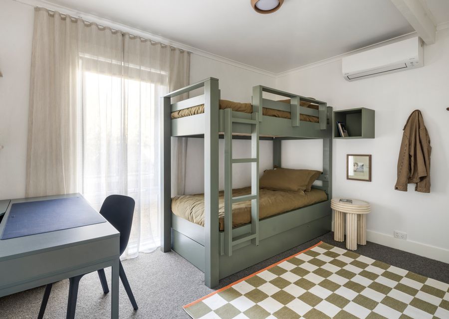 Bedroom three with Single bunk beds , a trundle bed and a study area