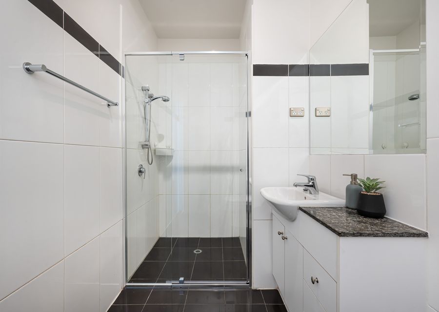 Downstairs bathroom with walk in shower and vanity