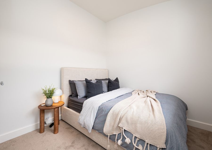 Bedroom 3 downstairs with Queen bed and electric radiator