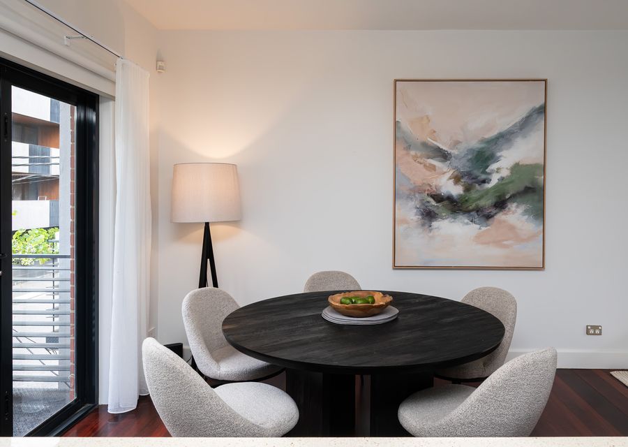 Dining with glass doors out to the balcony