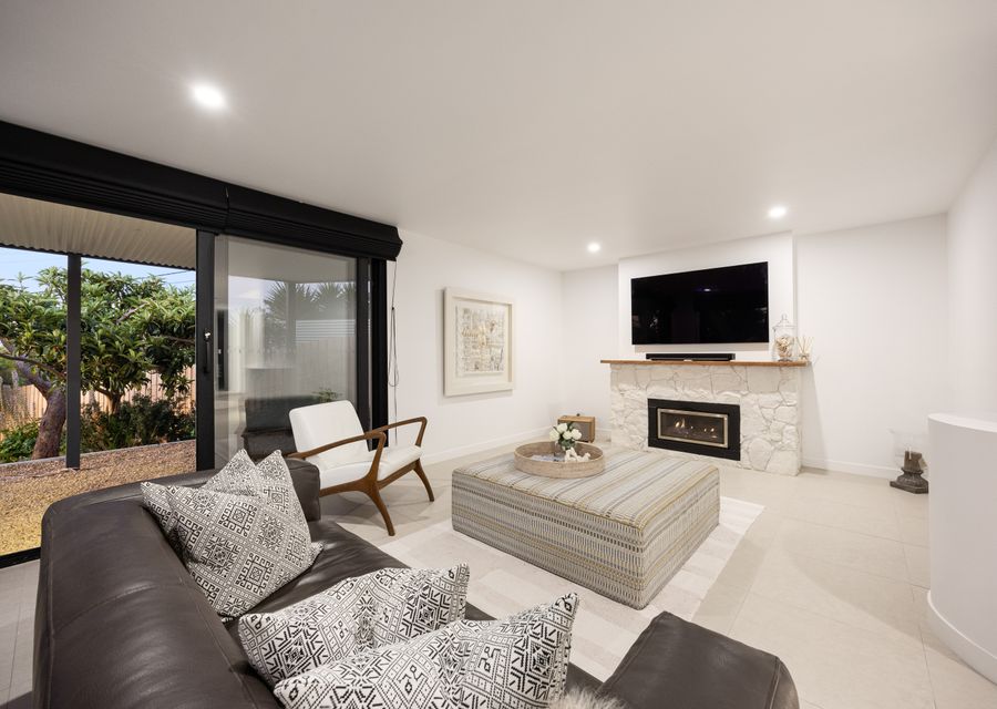 Downstairs living area with TV  & Gas Fireplace