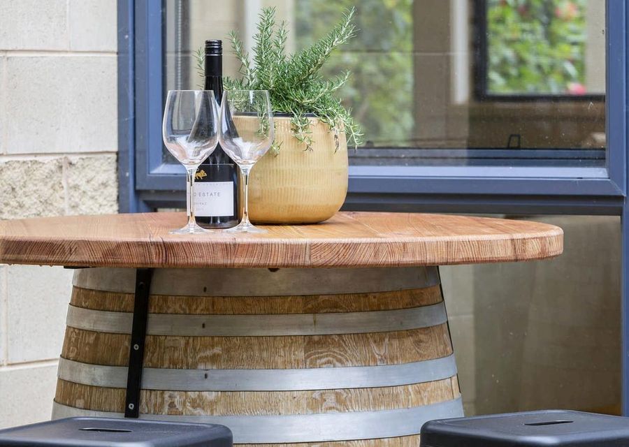 Enjoy a glass of wine under the olive tree