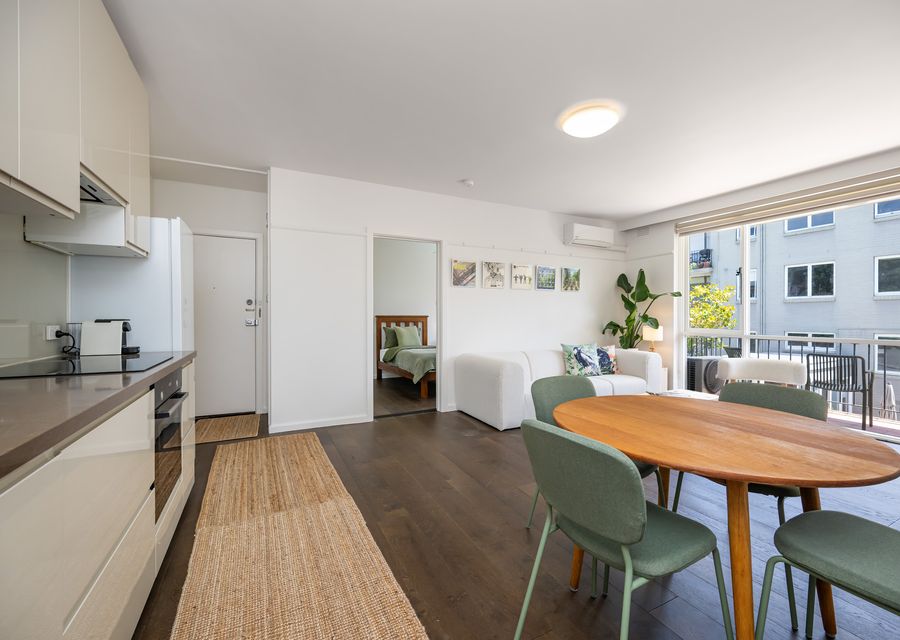 Open kitchen, dining, and living space.