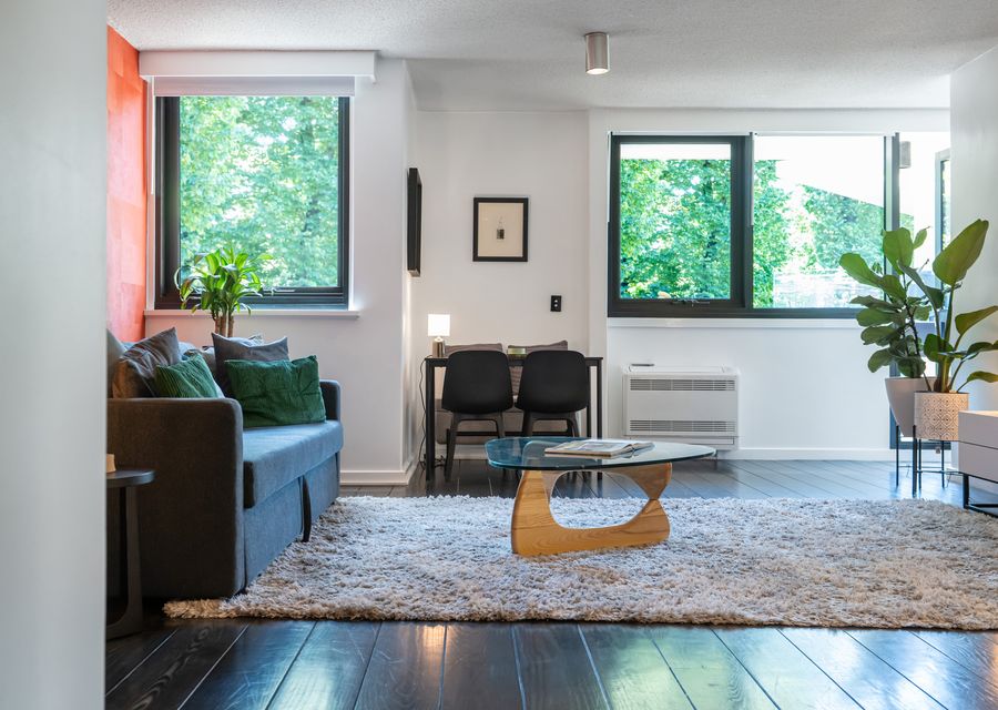 Open-plan living area adjacent to the dining table.