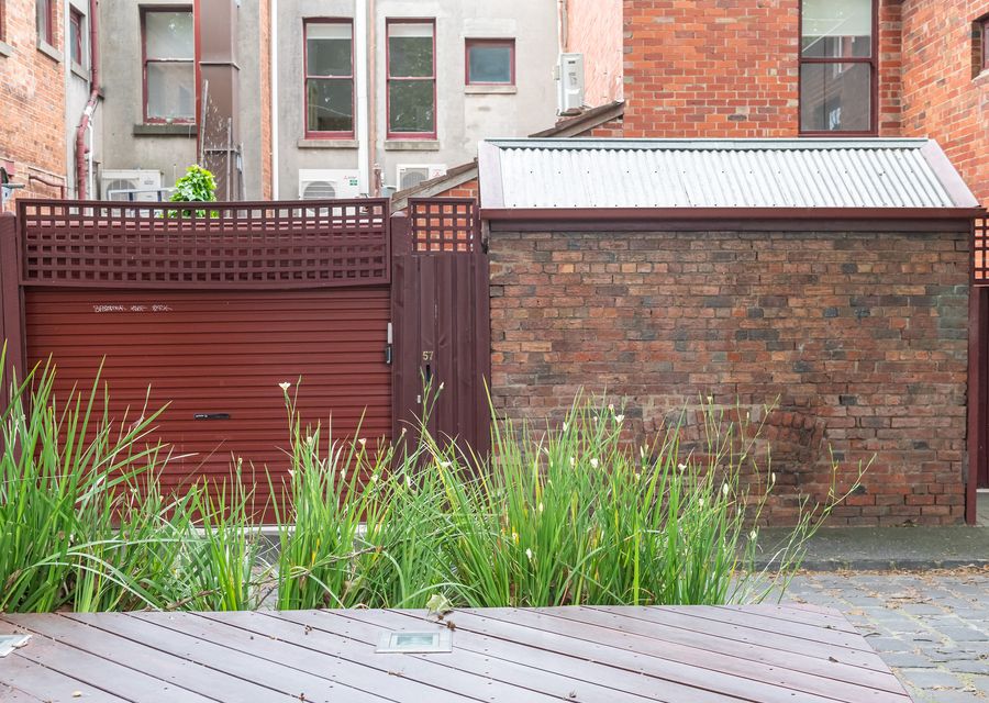 Roller door to the property with space for 1 car