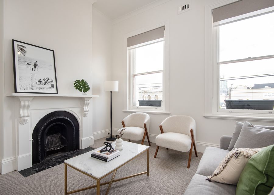 Formal lounge with decorative fire place and smart TV