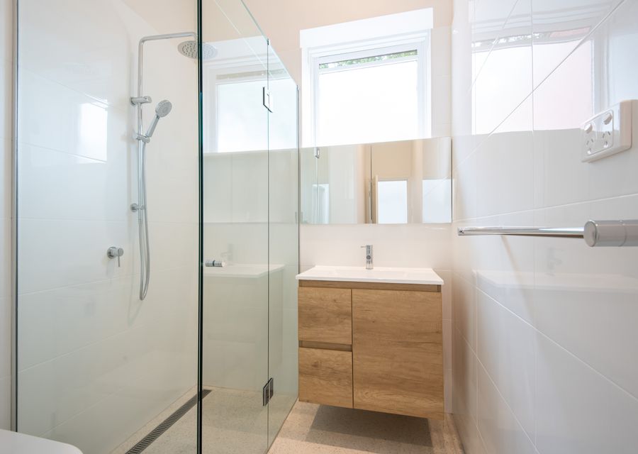 Walk in shower, single vanity and toilet