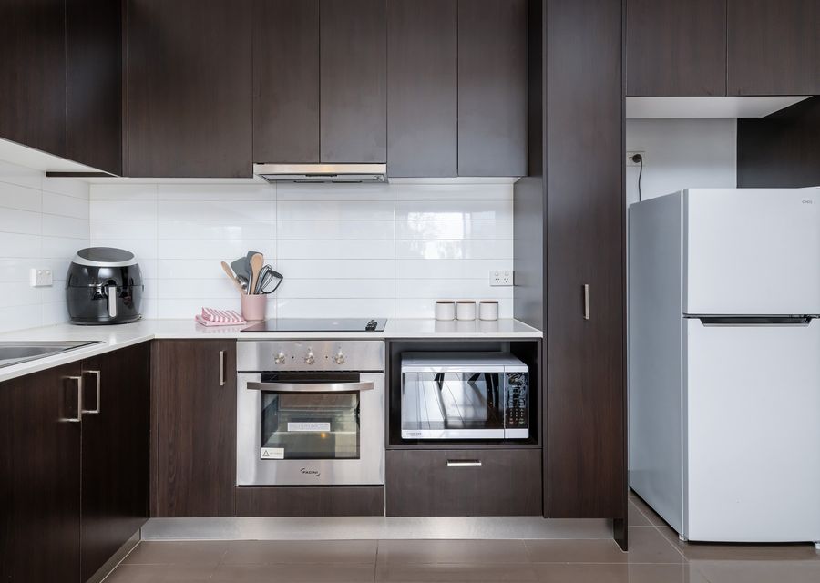 Fully equipped kitchen with microwave and oven and air fryer. 