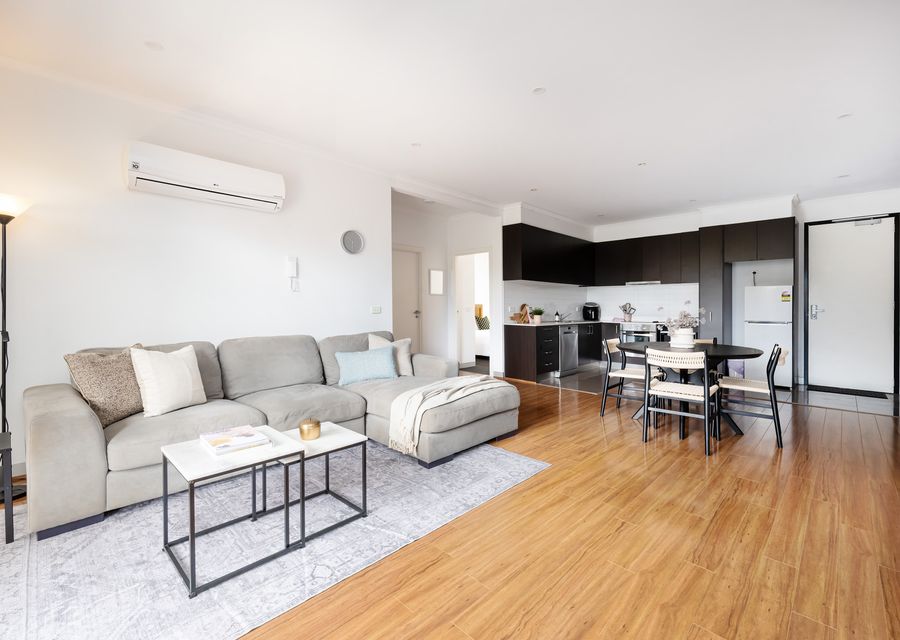 Living space with air conditioning and fully equipped kitchen 