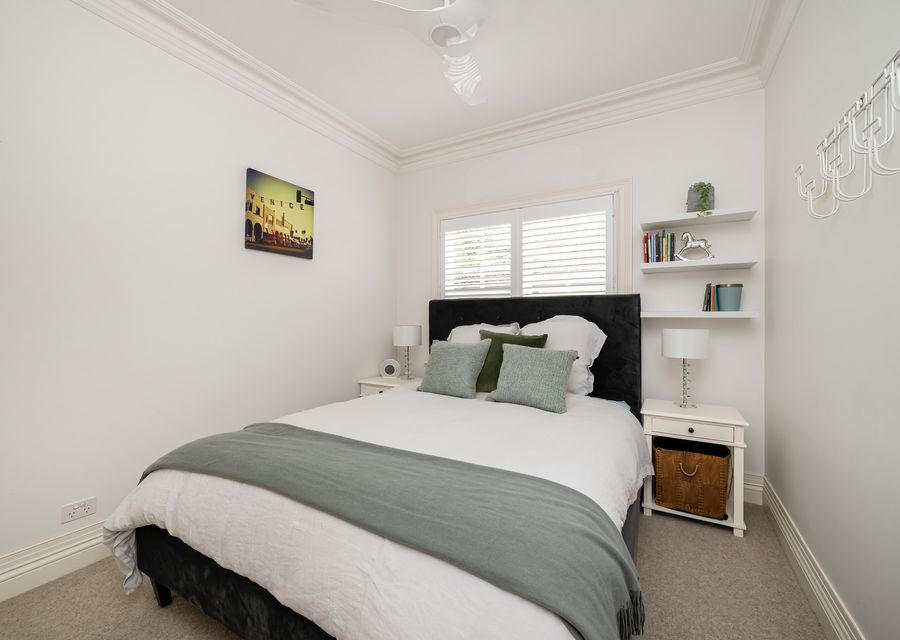 Bedroom 3 with queen bed and ceiling fan