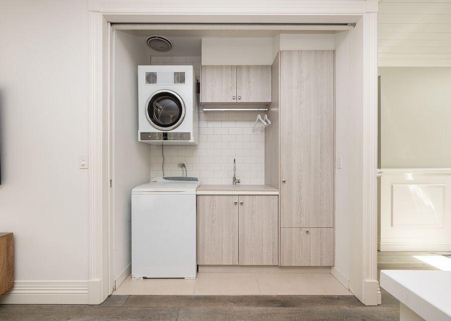 Laundry with top loader washing machine and seperate front loading dryer