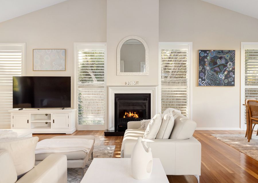 Lounge area with a smart TV and cosy gas fireplace