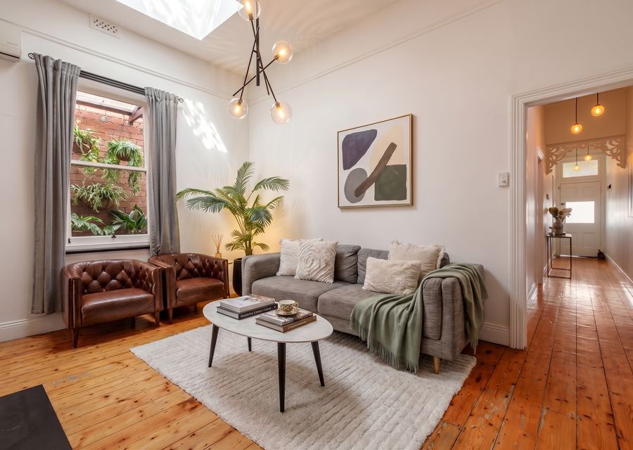 Living space with smart TV and ornamental fire place. Styled with comfort in mind.