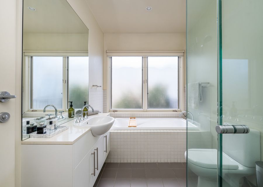 Upstairs bathroom with bathtub